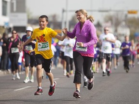 Joshua and Kelly Boechler finish their first 5k together at the annual Mother's Day Run on Sunday, May 10, 2015.