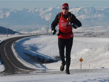 Marathon runner Martin Parnell runs along Highway 1A  near his Cochrane home on December 23, 2009 before embarking on a year long vision of running 250 marathons to raise $250,000 for the Right To Play organization.