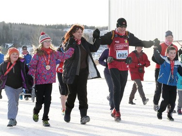 Martin Parnell finishes his last race for Right to Play in Cochrane, on December 31, 2014.