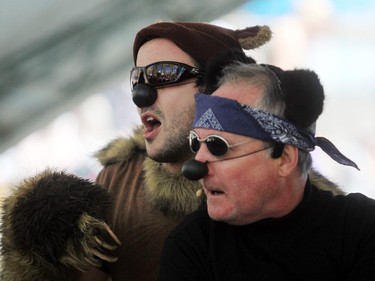 Park's Canada Mountain WIT! members Phillip Nugent, left, and David Thomson dressed up as a grizzley and black bear as they performed during the Wild Sings act at the Calgary International Children's Festival on May 21, 2015.