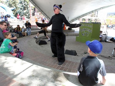 Park's Canada Mountain WIT! members David Thomson dressed up as a black bear as he and other members of the group performed during the Wild Sings act at the Calgary International Children's Festival on May 21, 2015.