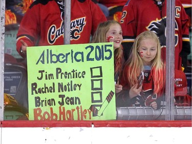 A young Calgary Flames fan held a sign for the election as the team warmed up prior to the game against the Anaheim Ducks in NHL playoff action at the Scotiabank Saddledome on May 5, 2015.