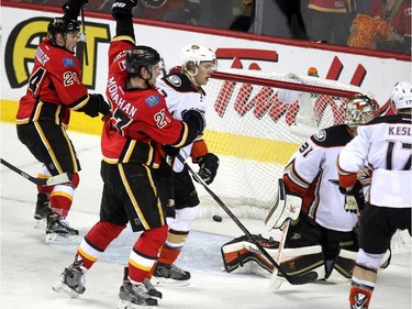 Calgary Flames centre Jiri Hudler, left, and Sean Monahan celebrated after linemate Johnny Gaudreau knocked the puck past Anaheim Ducks goalie Frederik Andersen to tie the game with 20 seconds left in regulation time during third period NHL playoff action at the Scotiabank Saddledome on May 5, 2015.