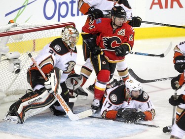 Calgary Flames centre Jiri Hudler fought for the puck against Anaheim Ducks centre Ryan Kesler outside the crease of goalie Frederik Andersen during the overtime period NHL playoff action at the Scotiabank Saddledome on May 5, 2015. Mikael Backlund scored the game winning goal at 4:24  of the first overtime to give the Flames their first win in the series.