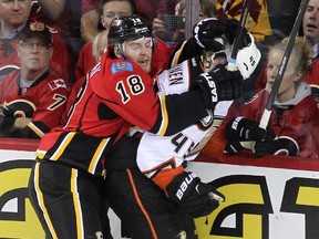 Calgary Flames centre Matt Stajan roughs up Anaheim Ducks defenceman Sami Vatanen during Game 3 on Tuesday night. The bigger Ducks were actually outhit by the Flames in the contest, which is a direct reason why Anaheim lost.