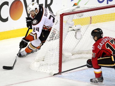 Anaheim Ducks defenceman Simon Despres skated around the back of the Flames net before setting teammate Corey Perry up for the Ducks second goal of the game as left winger Johnny Gaudreau tried to provide support during first period NHL playoff action at the Scotiabank Saddledome on May 5, 2015.
