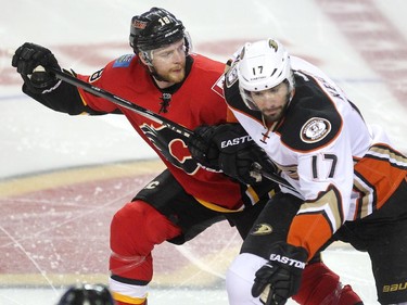 Calgary Flames centre Matt Stajan battled against Anaheim Ducks centre Ryan Kesler during first period NHL playoff action at the Scotiabank Saddledome on May 5, 2015.