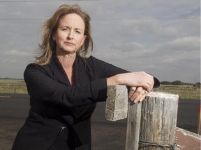 Rocky View County Reeve Margaret Bahcheli looks out across Township Road 250, McKnight Boulevard, just west of Conrich Friday May 29, 2015. The area around the hamlet is facing major change with proposed housing and industrial development. Truck traffic has increased dramatically since the opening of the CN Logistics Park.