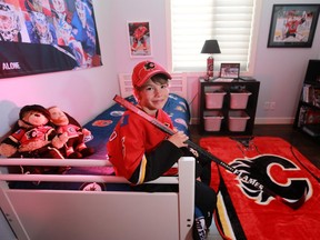 Eight-year-old Luke Vlooswyk is a big Flames fan, whose bedroom is a shrine to his beloved team and to NHL hockey.