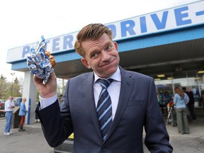 Leader of the Wildrose Party Brian Jean stops in at Peters' Drive -In for a milkshake and burger in Calgary on May 1, 2015.