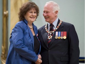 Governor General David Johnston invests Lois Mitchell, from Calgary, Alta. as a Member of the Order of Canada during a ceremony at Rideau Hall in Ottawa, on Friday May 3, 2013. Lois Mitchell has been appointed as the new Alberta lieutenant-governor.