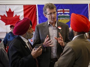 Liberal Leader David Swann  speaks with supporters  two days before the election.