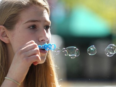 Volunteer Abigail Rae blew bubbles during Calgary International Children's Festival on May 20, 2015 as the annual event got under way at Olympic Plaza on Wednesday.