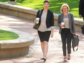 Premier Rachel Notley, right, walked into McDougall Centre in Calgary on May 27, 2015 for the first cabinet ministers meeting for the new NDP government.