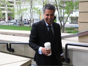 Minister of Human Services Ifran Sabir walked into the McDougall Centre for the second day of caucus meetings on May 28, 2015.