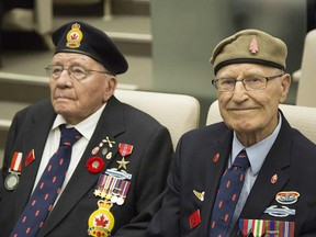 Leonard Corbett, left, and Bernard Cooper, members of the First Special Service Force, more commonly known as the Devil's Brigade, await a city council recognition of their service at City Hall in Calgary on Monday, May 25, 2015.
