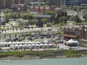 The changing East Village area stretches behind the tents and crowds of the Rock The Walk party on the RiverWalk Plaza.