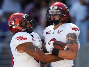 Wide receiver Cory Mitchell, right, of the Eastern Washington Eagles celebrates with a teammate after scoring a touchdown during a Sept. 2014 game. The older brother of Stamps quarterback Bo Levi Mitchell will attempt to make Calgary's roster in next month's training camp.
