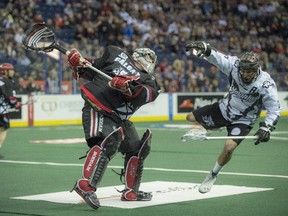 Calgary Roughnecks goalie Frankie Scigliano trips up Edmonotn Rush goalie Jarrett Davis during a meeting between the rivals last month.