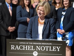 Newly elected NDP MLAs line up in front of Government House to hear Rachel Notley's speech before their first Caucus meeting on Saturday May 9, 2015.