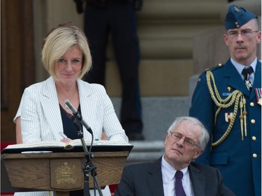 Premier Rachel Notley and her 11 cabinet ministers are sworn in on the legislature steps in Edmonton.