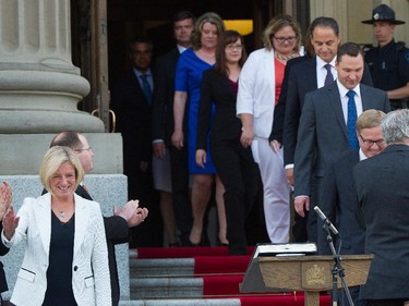 Premier  Rachel Notley and her 11 cabinet ministers arrive to be sworn in on the legislature steps in Edmonton . May 24, 2015.