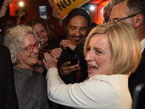 Premier Elect NDP Rachel Notley passes MP NDP Linda Duncan (L) before speaking to supporters at the NDP election night headquarters in the Westin Hotel in Edmonton, May 5, 2015.