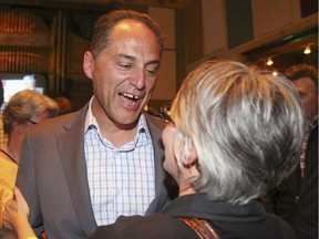 Joe Ceci embraces NDP supporters at the Arrata Opera Centre in Calgary on Tuesday, May 5, 2015.