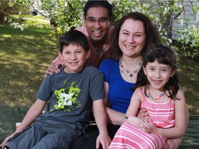 The Lima-Coelho family including dad, Ken, mom Tara, and children Adam, 10, and Ashlyn, 7 in their Calgary backyard .