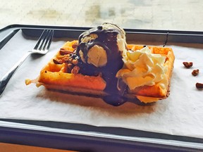 Village ice cream and melted chocolate on a crisp waffle at Buttermilk Fine Waffles