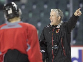 Calgary Flames head coach Bob Hartley gives instructions to his players during practice on Wednesday, the day he was announced as one of three nominees for the NHL's coach of the year award.