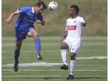 Foothills FC player Mitchell Bauche, right, moves in to block a Puget Sound Gunner header at Hellard Field in Calgary on Sunday, May 17, 2015. The Foothills FC under-23 team won over the Puget Sound Gunners, 2-1, in their home opening game.