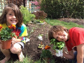 From L-R Cohen (age 7) and Kalen (9) goof around in the garden - a lot