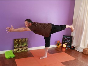 Gavin Young, Calgary Herald CALGARY, AB: APRIL 13, 2015 - Hart Steinfeld demonstrates the L stand at the wall with one leg lifted for Johanna Steinfeld's May 2015 yoga column. Gavin Young/Calgary Herald)  (For You section story by Jo Steinfeld) Trax#
