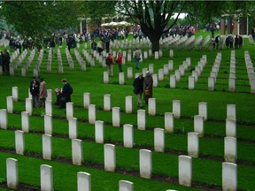 People walk among the graves at the Groesbeek Canadian War Cemetery in the Netherlands. Reader says he is impressed at how faithfully the Dutch tend Canadian soldiers' graves.