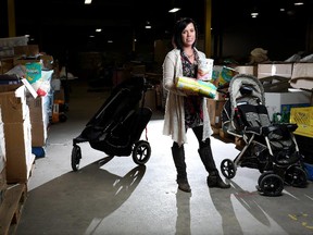 Melissa Nelson, former executive director of NeighbourLink, at the warehouse in Calgary, is worried about the future of the not-for-profit company.