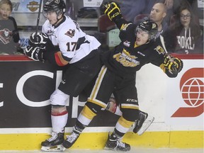 Calgary Hitmen' Jordy Stallard bumps with Brandon Wheat King Jayce Hawryluk during Game 4 of their Western Hockey League Eastern Conference final series last week at the Scotiabank Saddledome. Stallard's family home is only a few blocks from the Wheat Kings' home in Brandon.