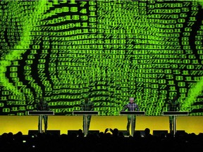 German electronic music band Kraftwerk perform on stage during a 3D concert at the Auditorium Stravinski Hall stage, during the 47th Montreux Jazz Festival in Montreux, Switzerland, Wednesday, July 17, 2013. The are bringing the same show to Calgary in September.
