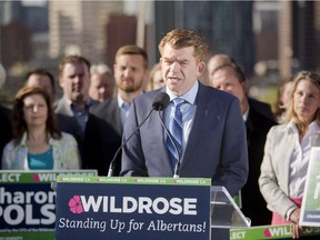 Brian Jean, along with other Wildrose candidates, speaks about the dangers of voting for the NDP at Rotary Park in Crescent Heights in Calgary on Monday, May 4, 2015.