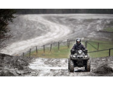 A quadder drove through the muddy trails at the McLean Creek Provincial Recreation area on May 16, 2015.