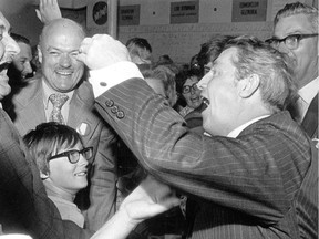 Peter Lougheed celebrates with supporters after the Tories defeated the Social Credit government on Aug. 30, 1971.
