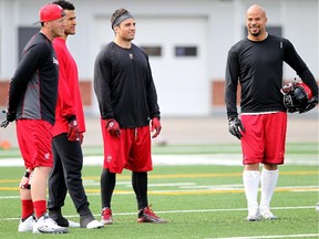 Stampeder Veteran players Bo Levi Mitchell, left, Anthony Parker, Matt Walter and Jon Cornish keep an eye on the rookies in the morning rookie practice for the Calgary Stampeders on May 29, 2015.