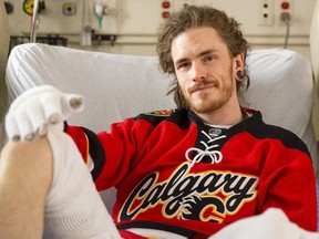 Flames fan Greg Morton recovers from his injuries in the Foothills hospital on Saturday, May 10, 2015. Morton received second-degree burns on much of his body while fire dancing on the red mile.