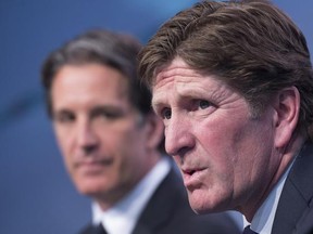 Toronto Maple Leafs new head coach Mike Babcock, right, speaks to reporters with president Brendan Shanahan during a press conference in Toronto on Thursday, May 21, 2015.