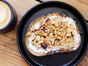 Toast slathered with creamy labneh topped with toasted B.C. hazelnuts and local honey.