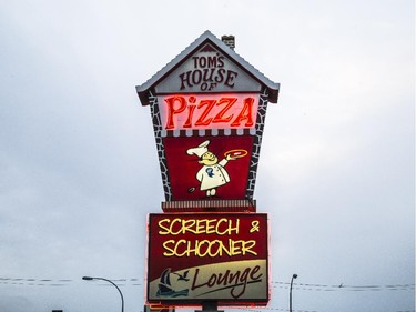 Tom's House of Pizza's neon sign along International Avenue in Calgary on Wednesday, May 13, 2015.