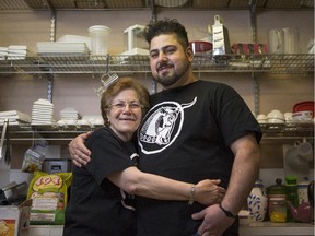 Amir Khezri, right, stands in the kitchen of Atlas Specialty Supermarket and Persian Cuisine with his mother Pari work together on a daily basis.