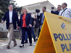 Alberta premier Jim Prentice leaves the Rosedale School poling station with his wife Karen after voting in the provincial election on the morning of May 5 at Rosedale School.  Prentice resigned that night.