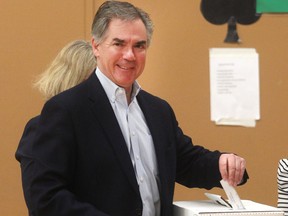 Jim Prentice casts his ballot in the provincial election on Tuesday morning at Rosedale School.