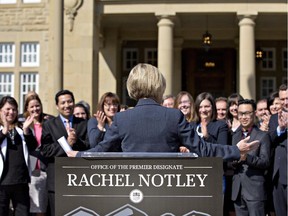 Alberta Premier-designate Rachel Notley turns to her caucus after speaking to media in Edmonton, Alta., on Saturday, May 9, 2015.